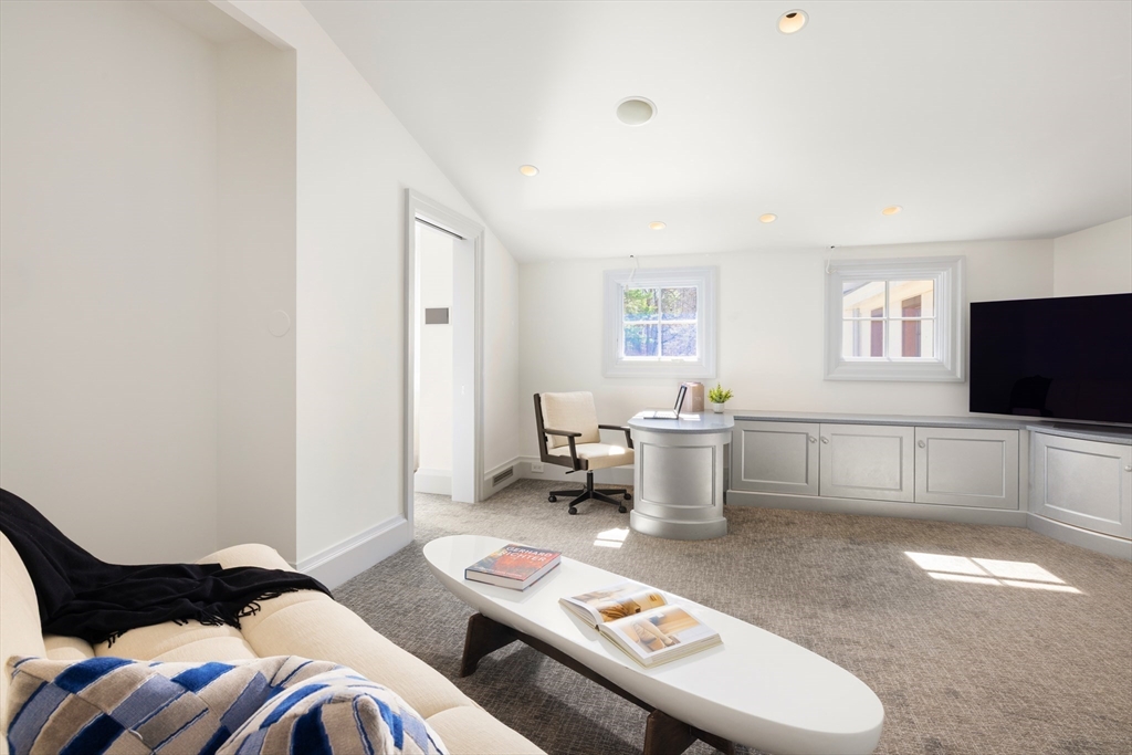 67 Byron Road Weston, MA 02493 - Photo 15 of 42 a living room with furniture and a flat screen tv