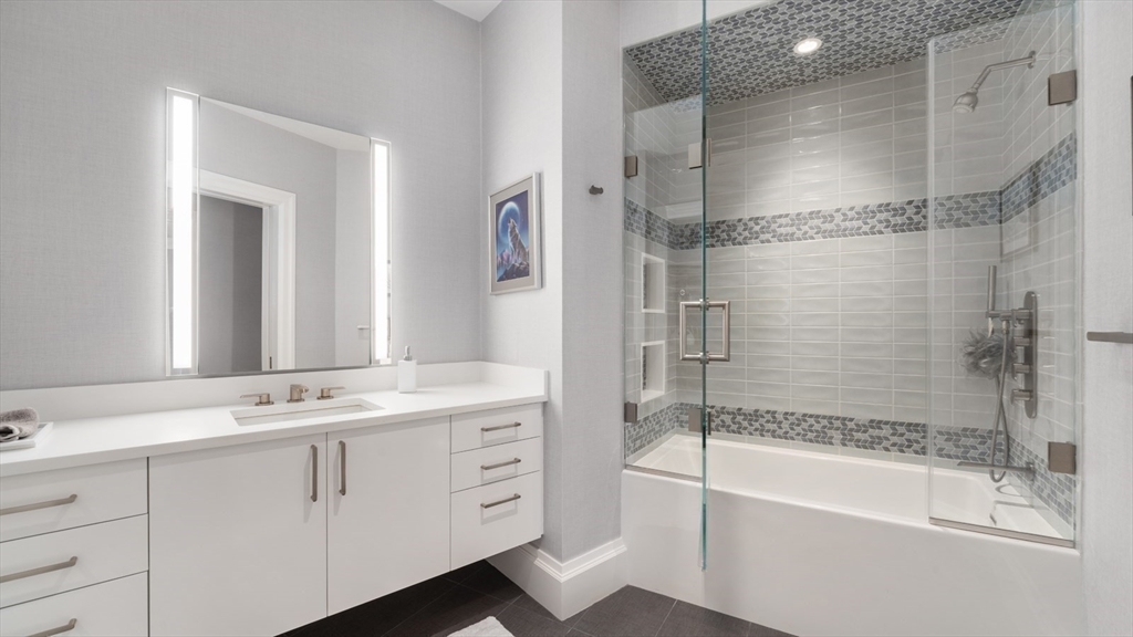 67 Byron Road Weston, MA 02493 - Photo 20 of 42 a bathroom with a bathtub and a sink