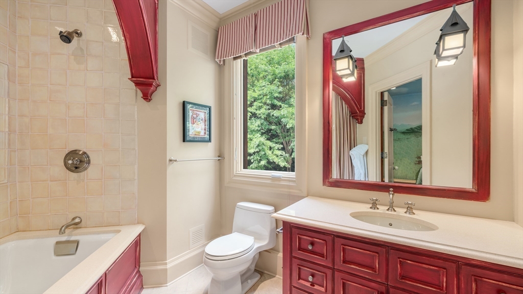 67 Byron Road Weston, MA 02493 - Photo 26 of 42 a bathroom with a double vanity sink toilet and a mirror