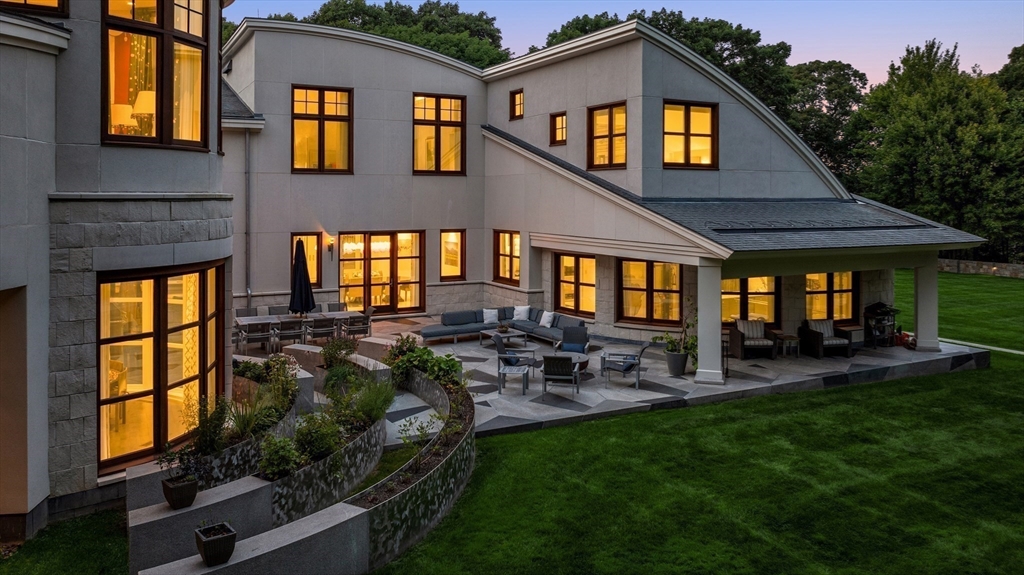 67 Byron Road Weston, MA 02493 - Photo 40 of 42 a front view of a house with patio and garden