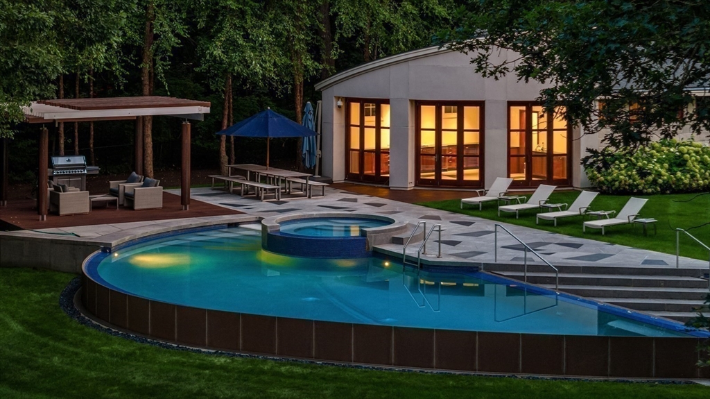 67 Byron Road Weston, MA 02493 - Photo 41 of 42 a view of a house with backyard swimming pool and sitting area