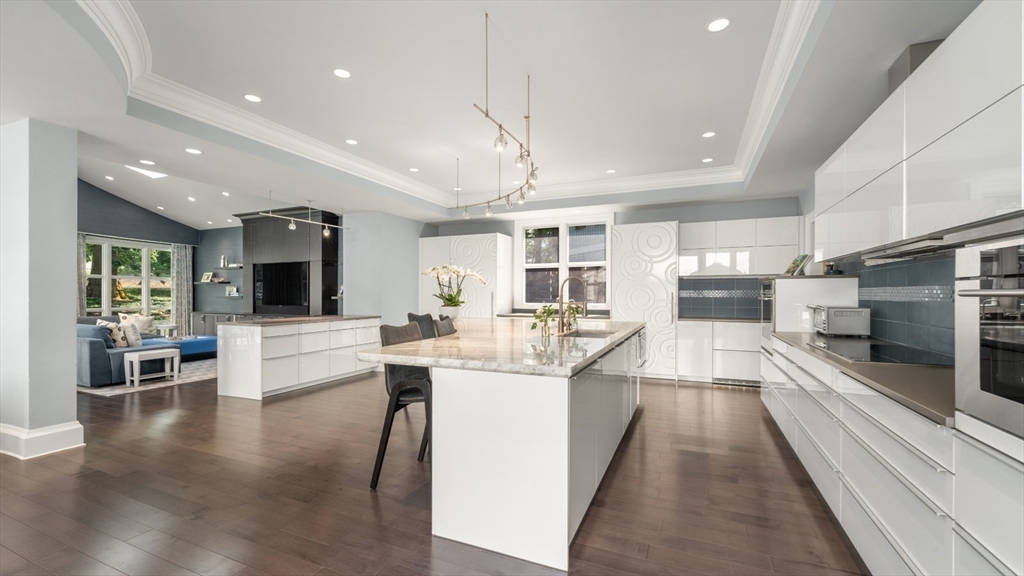67 Byron Road Weston, MA 02493 - Photo 8 of 42 a large kitchen with a table and chairs