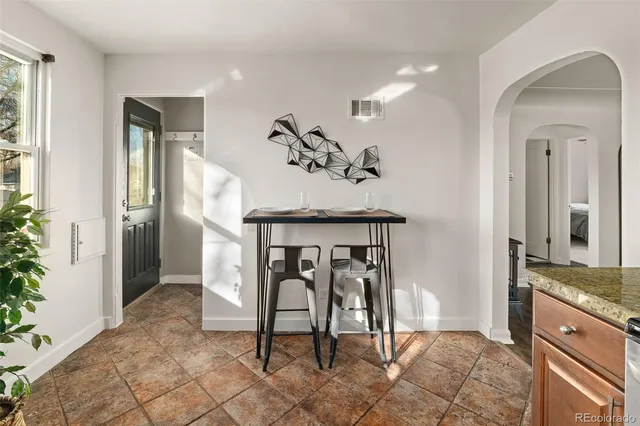 a view of living room filled with furniture and window