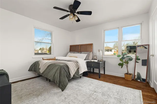 a bedroom with a bed and a table