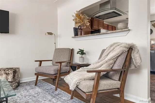 a view of a livingroom with furniture and flat screen tv