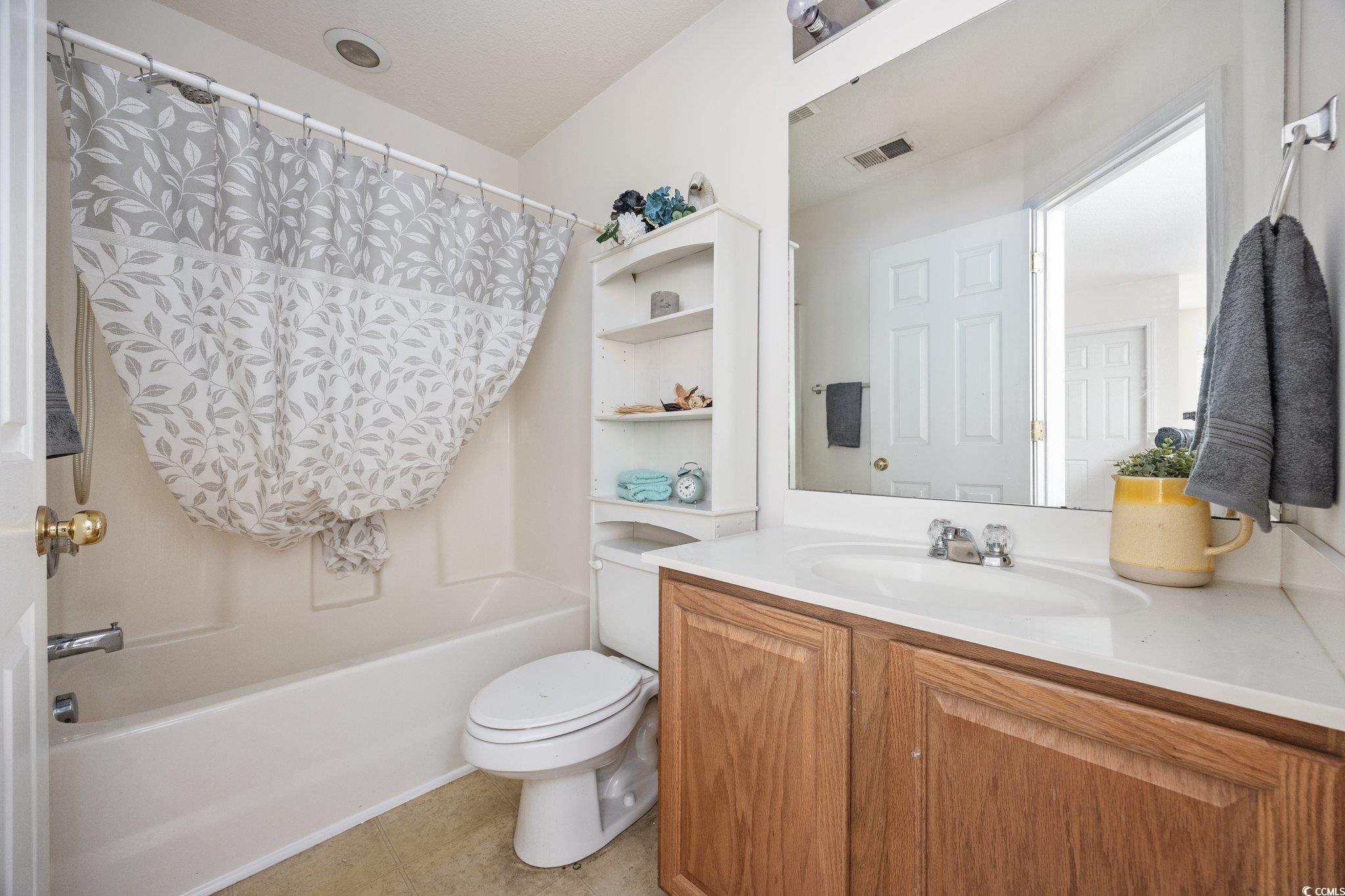 155 Chenoa Drive, Unit E Murrells Inlet, SC 29576 - Photo 14 of 34 Empty room with carpet and a ceiling fan