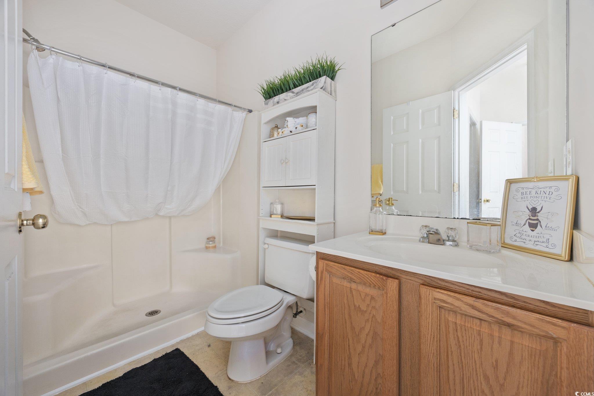 155 Chenoa Drive, Unit E Murrells Inlet, SC 29576 - Photo 18 of 34 Empty room with light colored carpet and baseboards