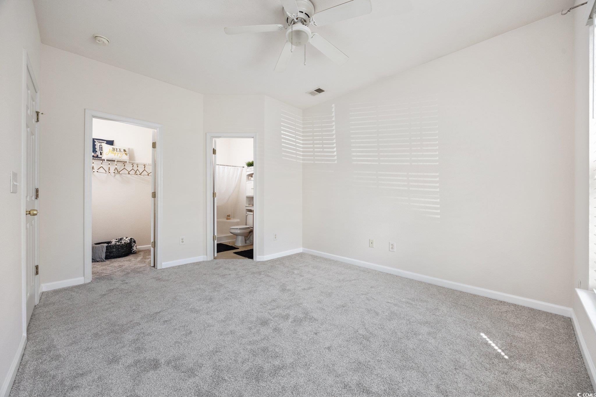 155 Chenoa Drive, Unit E Murrells Inlet, SC 29576 - Photo 19 of 34 Empty room with carpet floors and baseboards