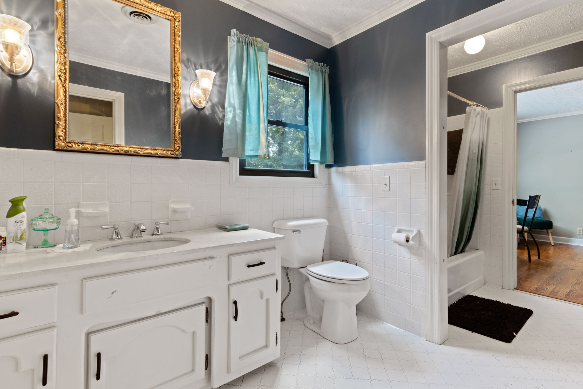102 3rd Avenue East Springfield, TN 37172 - Photo 46 of 65 a bathroom with a sink a toilet and a mirror