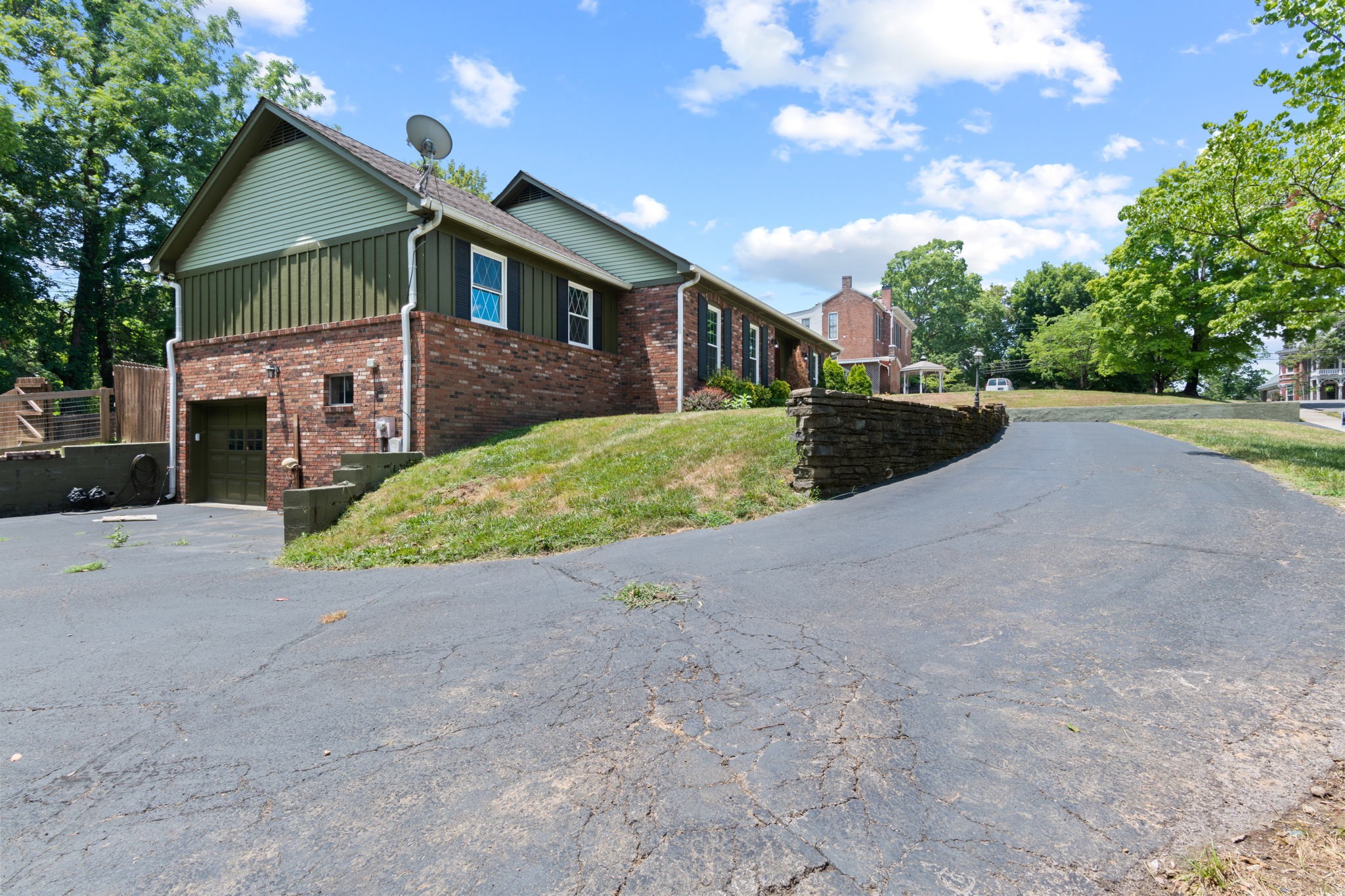 102 3rd Avenue East Springfield, TN 37172 - Photo 5 of 65 a front view of a house with a yard and garage