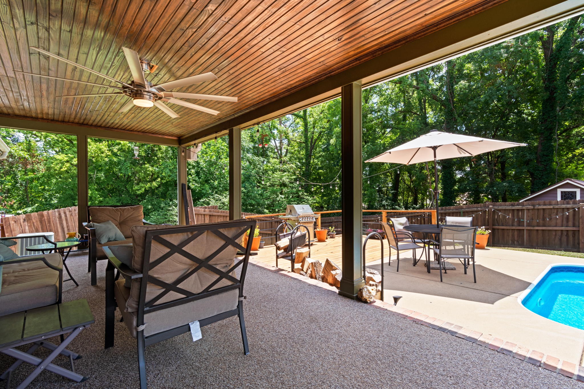 102 3rd Avenue East Springfield, TN 37172 - Photo 6 of 65 a view of a patio with a table chairs and a backyard