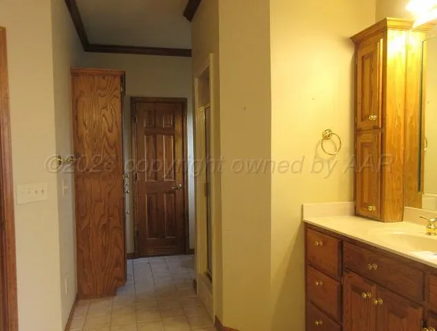 a bathroom with a mirror and a sink