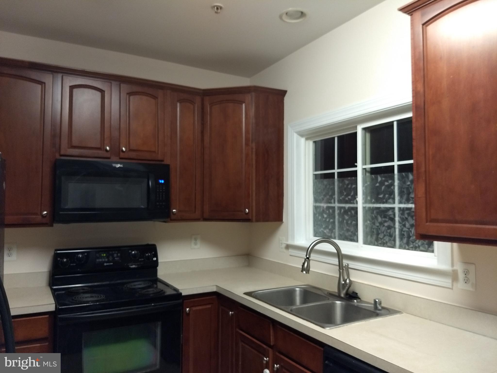 3350 Castle Ridge Circle, Unit 1 Silver Spring, MD 20904 - Photo 9 of 43 Kitchen has upgraded cherry cabinets