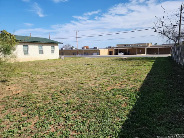 a house view with swimming pool