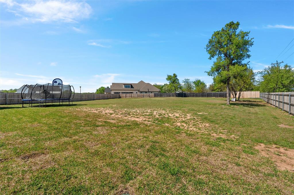 216 Wycliff Drive China Spring, TX 76633 - Photo 37 of 40 a view of a lake with a big yard