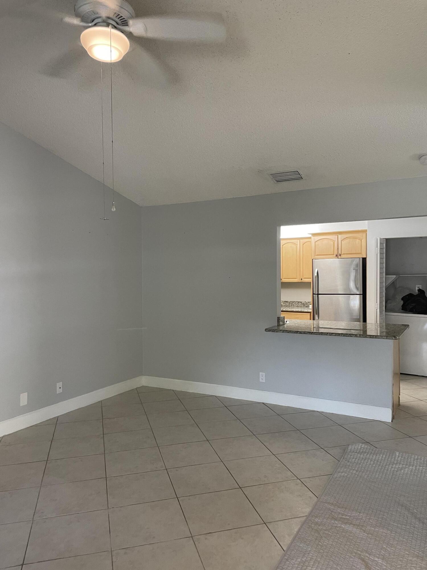 9037 Southeast Hobe Ridge Avenue Hobe Sound, FL 33455 - Photo 2 of 12 Large Living Room