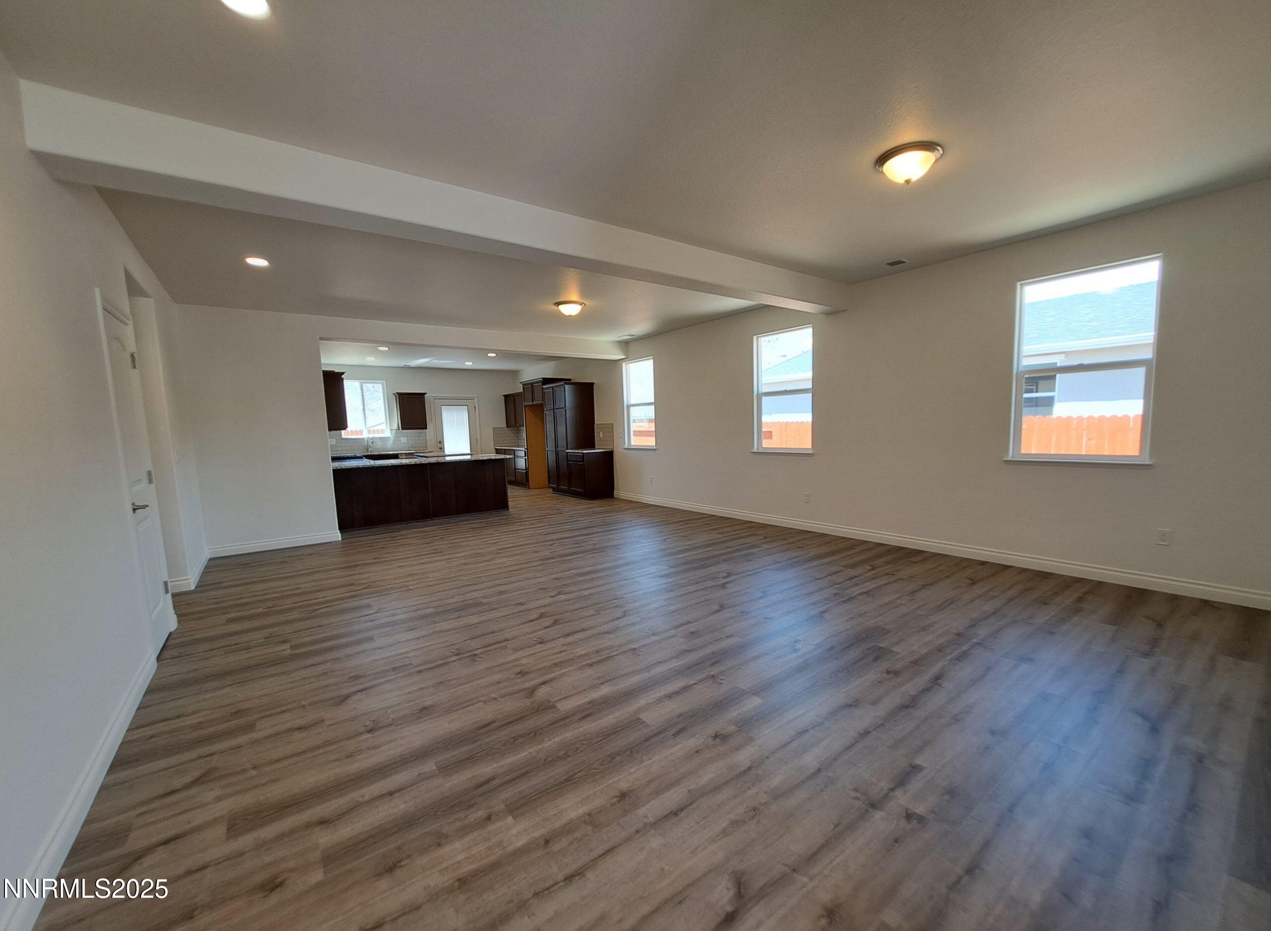 4048 Cold Springs Reno, NV 89508 - Photo 3 of 8 a view of empty room with wooden floor and windows