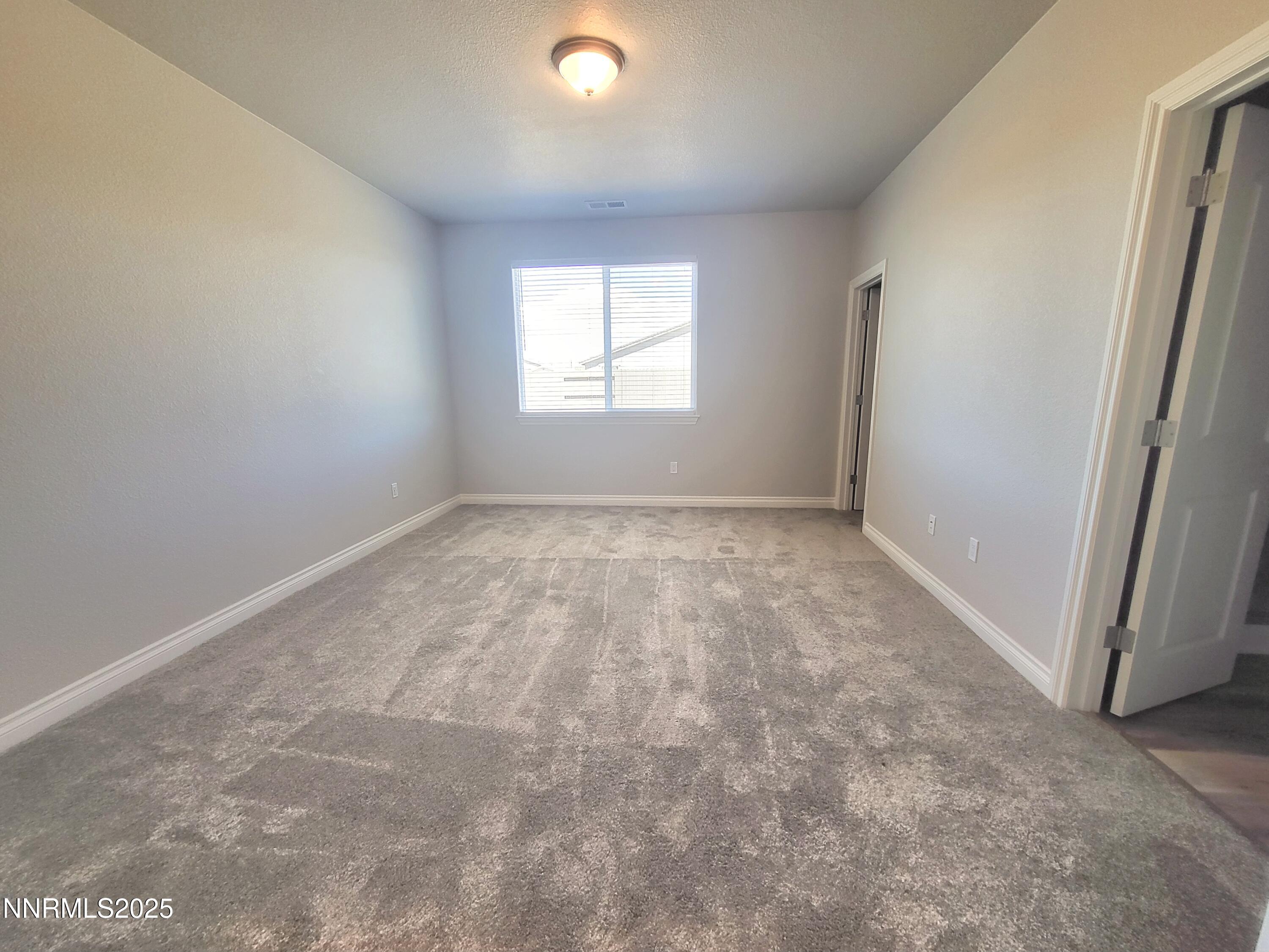4048 Cold Springs Reno, NV 89508 - Photo 4 of 8 an empty room with windows
