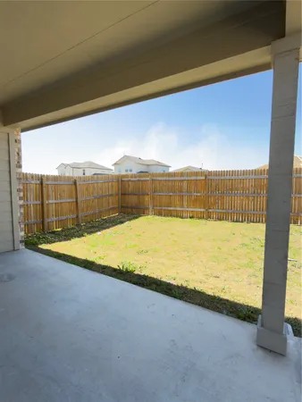 a view of a swimming pool with an outdoor space and seating area