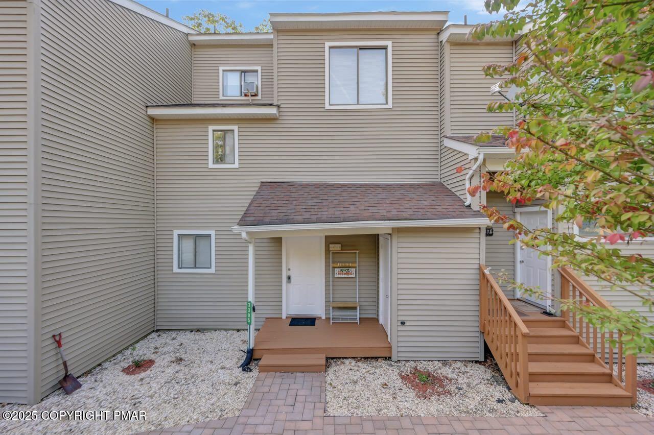 a front view of a house with a garden