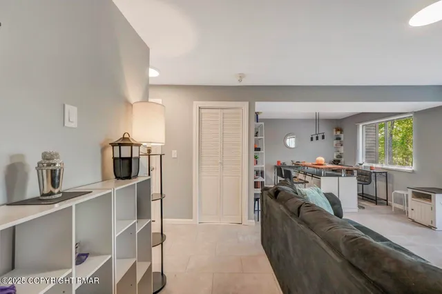 a living room with furniture and a window