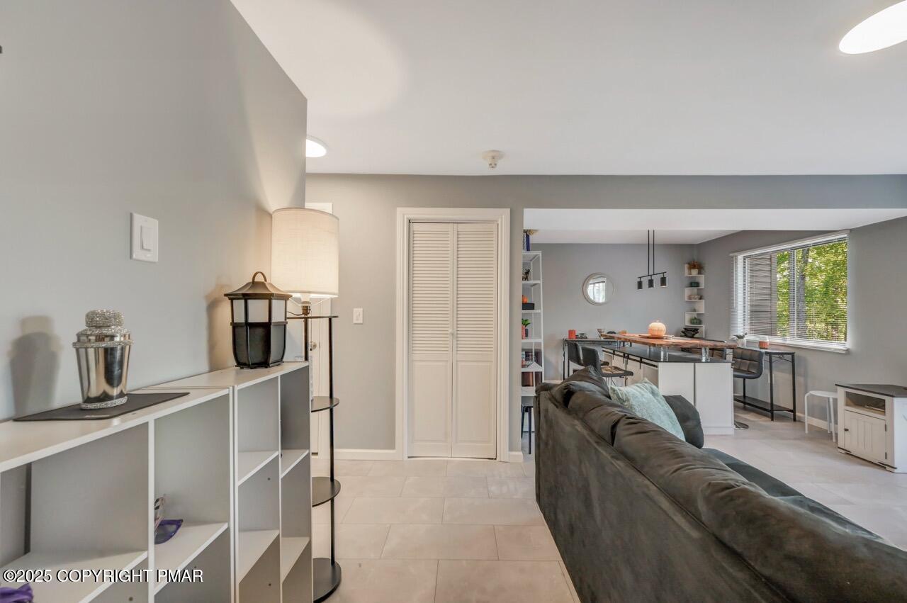 3305 Windemere Drive Bushkill, PA 18324 - Photo 12 of 56 a living room with furniture and a window