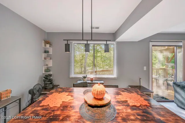 a view of a dining room with furniture window and outside view