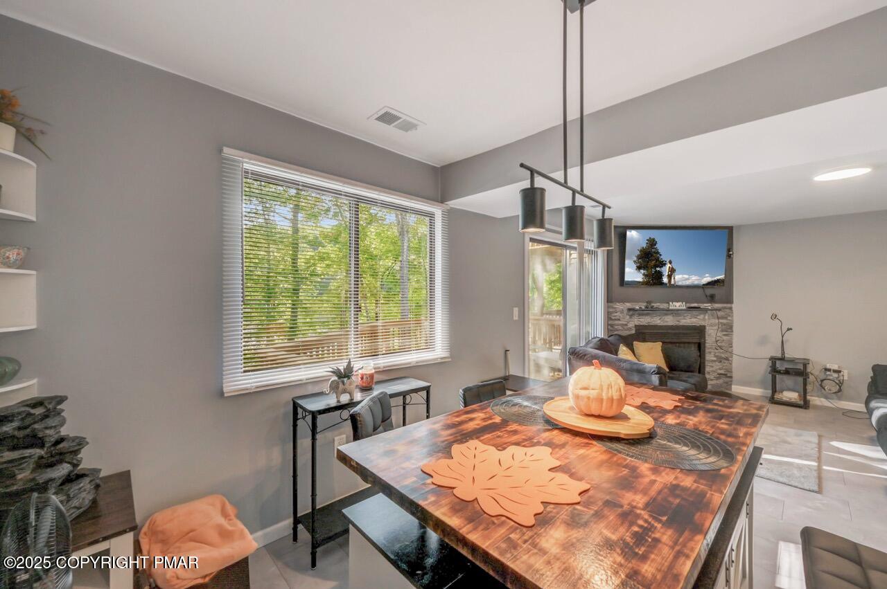 3305 Windemere Drive Bushkill, PA 18324 - Photo 21 of 56 a view of a dining room with furniture window and outside view