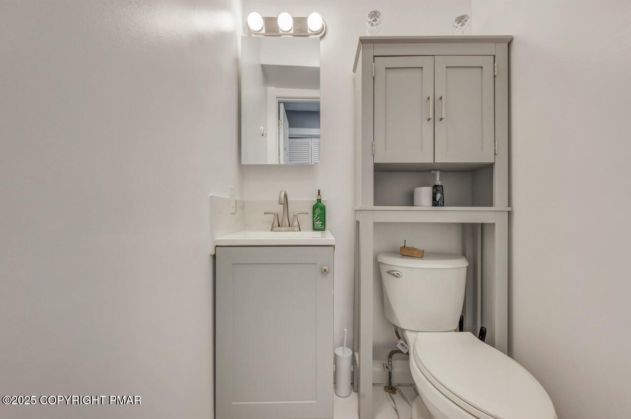 3305 Windemere Drive Bushkill, PA 18324 - Photo 24 of 56 a white toilet sitting next to a bathroom sink