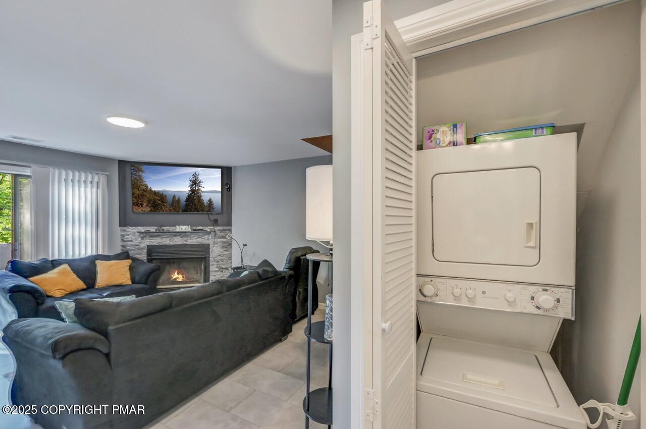 3305 Windemere Drive Bushkill, PA 18324 - Photo 25 of 56 a living room with furniture and a fireplace