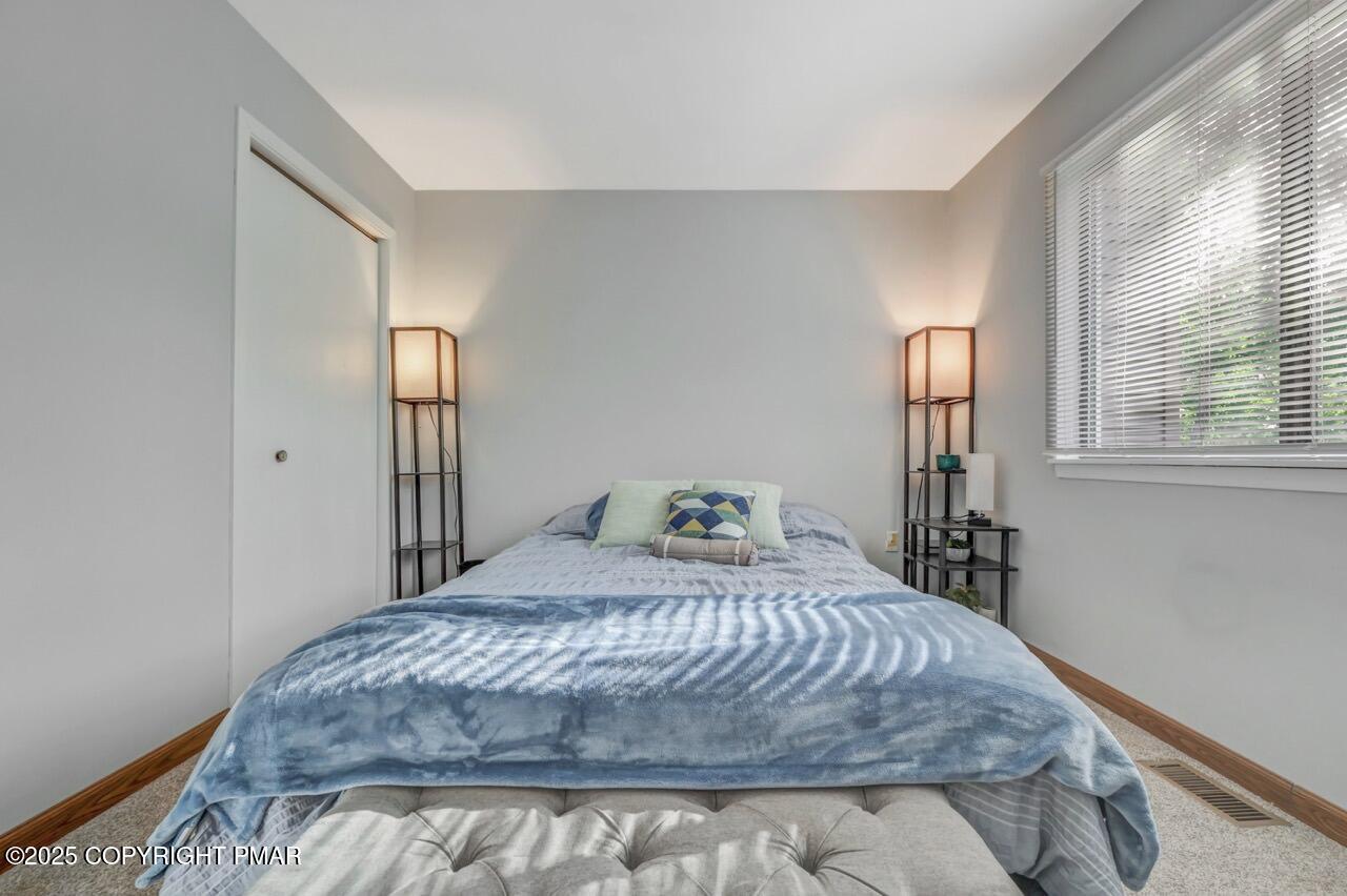 3305 Windemere Drive Bushkill, PA 18324 - Photo 30 of 56 a bedroom with a bed and window