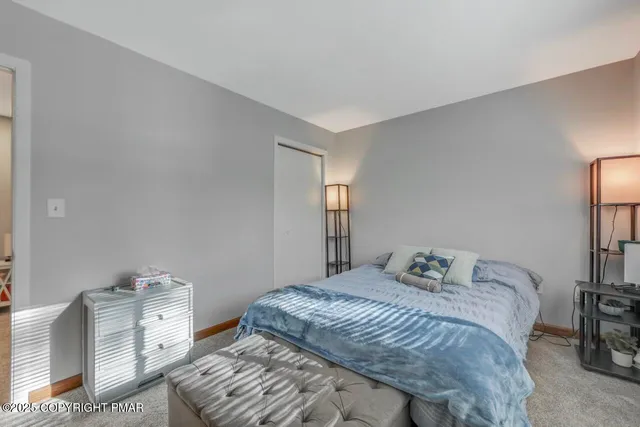 a bathroom with a sink toilet a mirror and shower