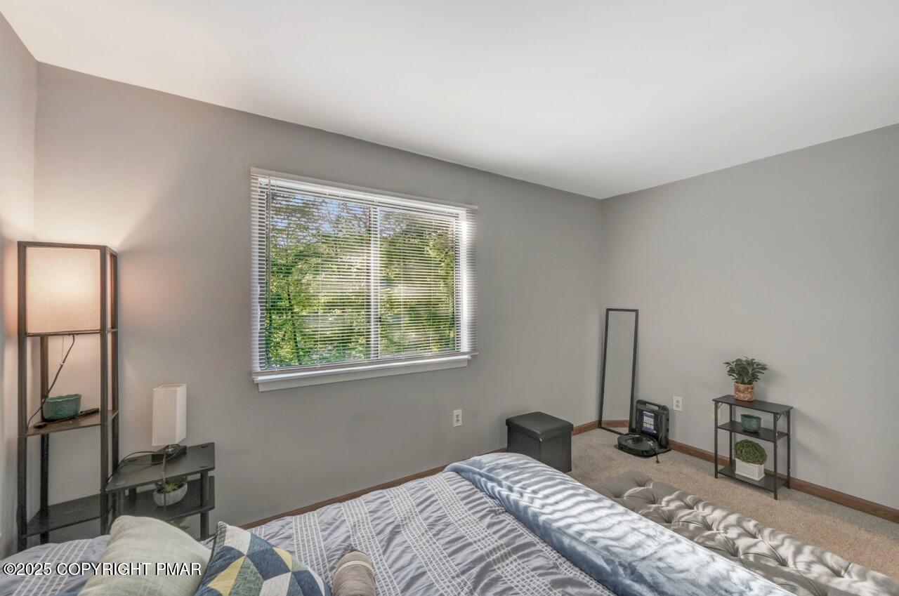 3305 Windemere Drive Bushkill, PA 18324 - Photo 32 of 56 a bedroom with a bed and a dresser next to a window