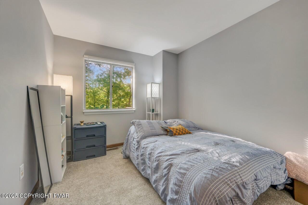 3305 Windemere Drive Bushkill, PA 18324 - Photo 36 of 56 a bedroom with a bed and window