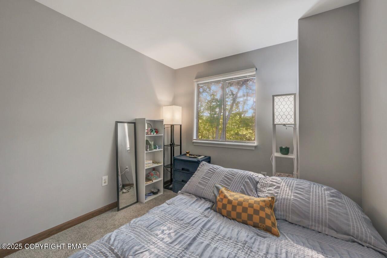 3305 Windemere Drive Bushkill, PA 18324 - Photo 37 of 56 a bedroom with a bed and a window