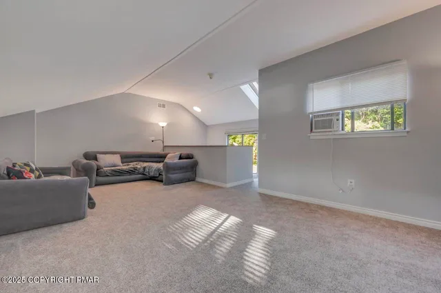 a view of balcony with wooden floor and outdoor seating