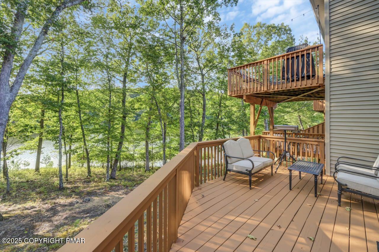 3305 Windemere Drive Bushkill, PA 18324 - Photo 48 of 56 a view of balcony with wooden floor and outdoor seating