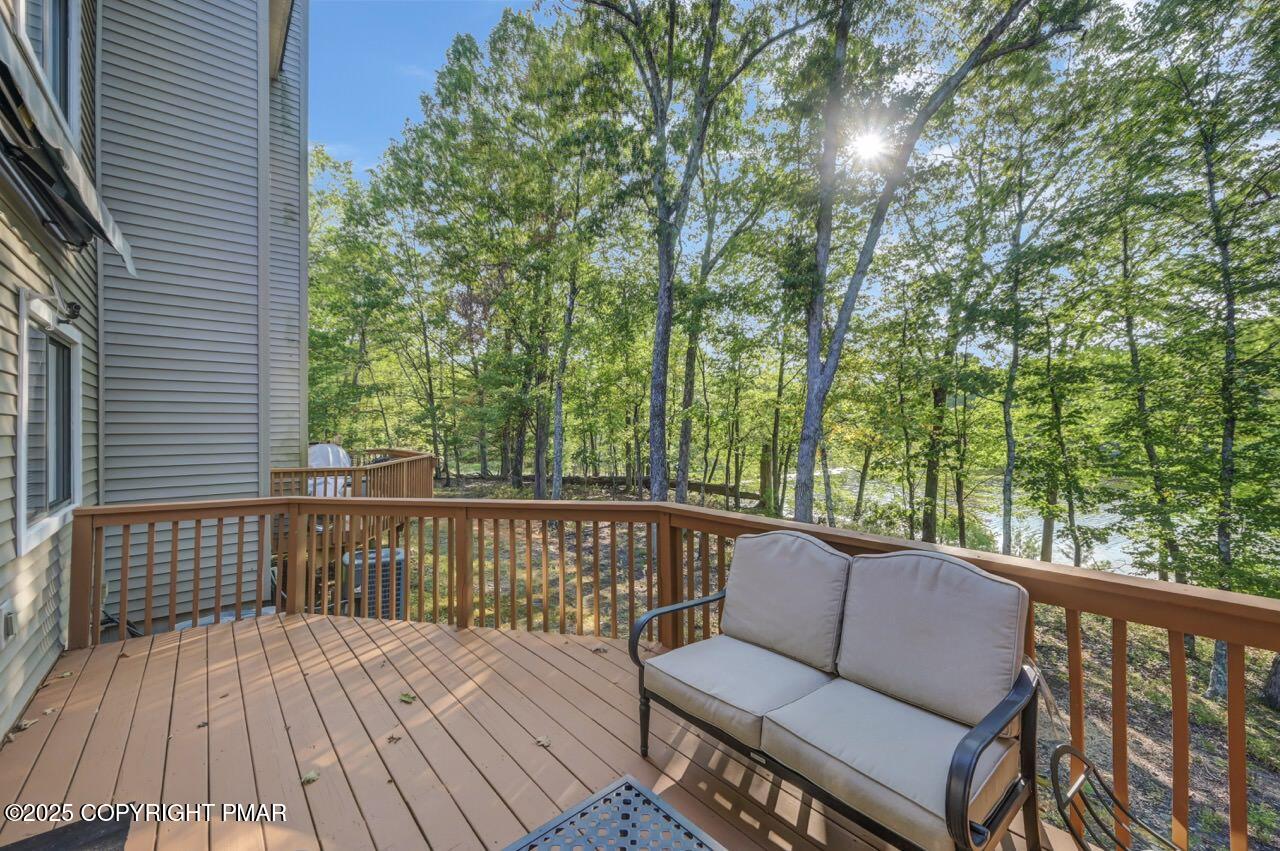 3305 Windemere Drive Bushkill, PA 18324 - Photo 49 of 56 a balcony with wooden floor and outdoor seating