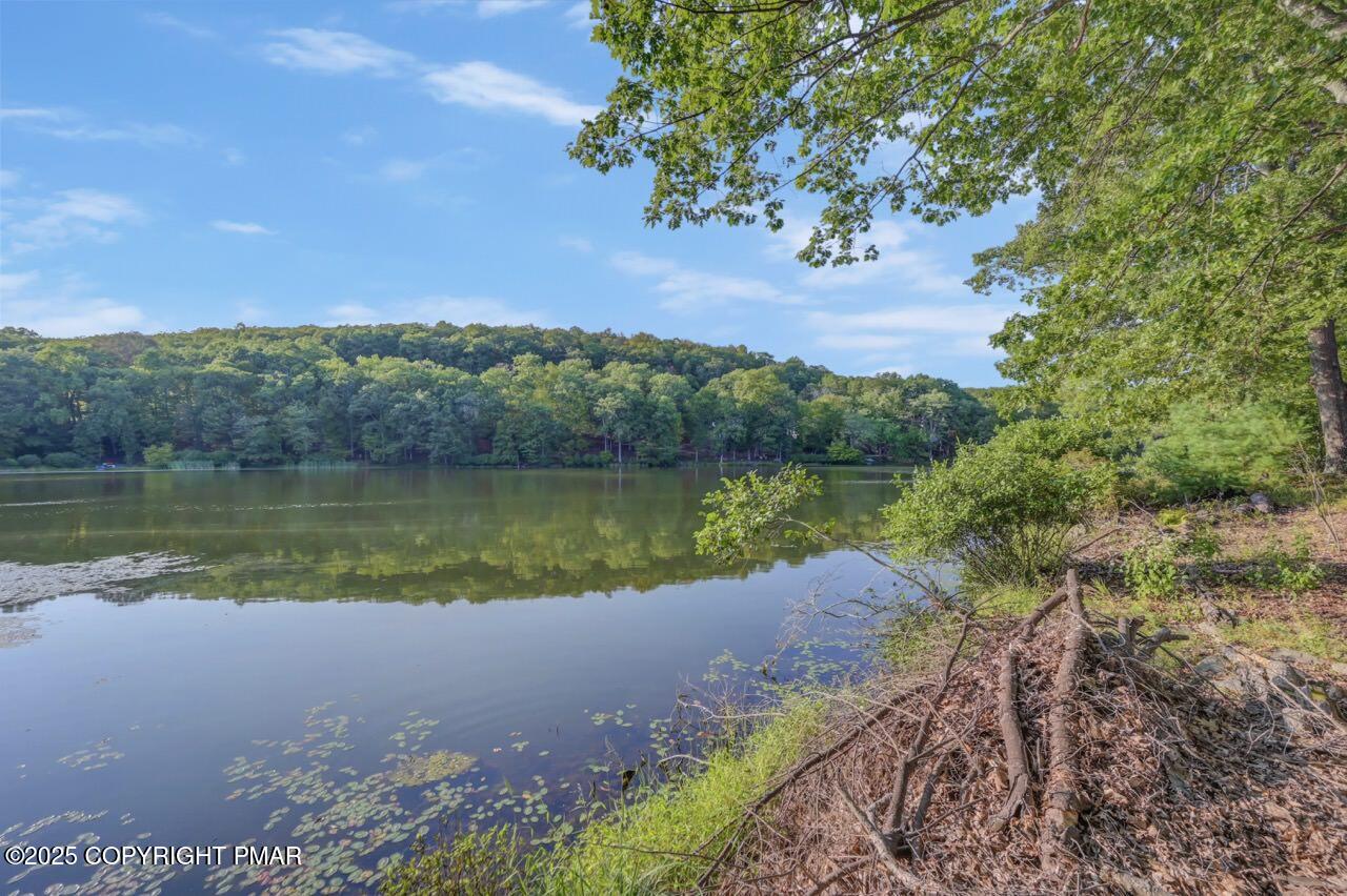 3305 Windemere Drive Bushkill, PA 18324 - Photo 53 of 56 a view of a lake with a mountain in the background