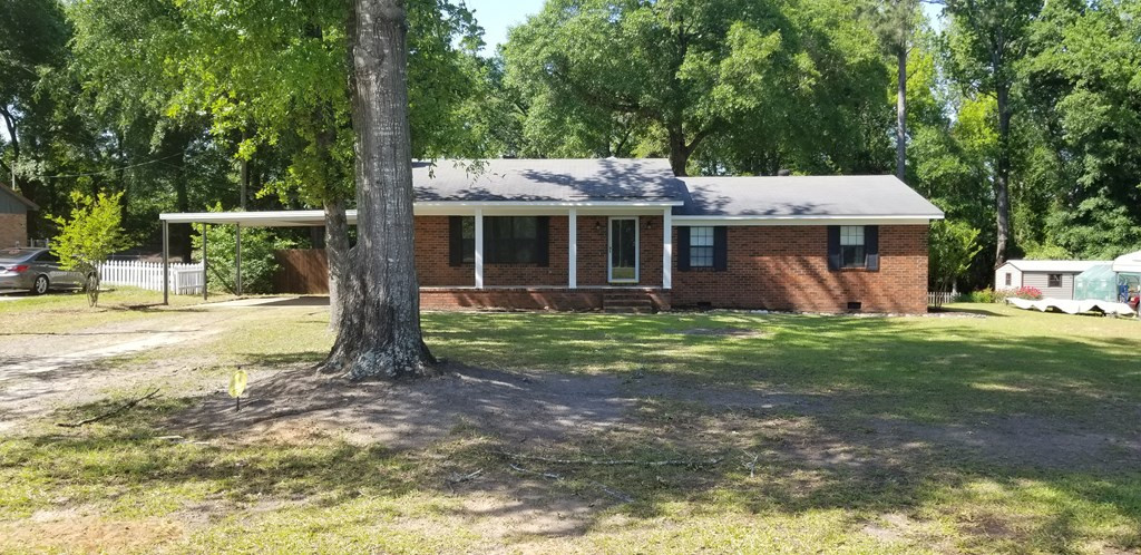 Very wide and deep carport.
