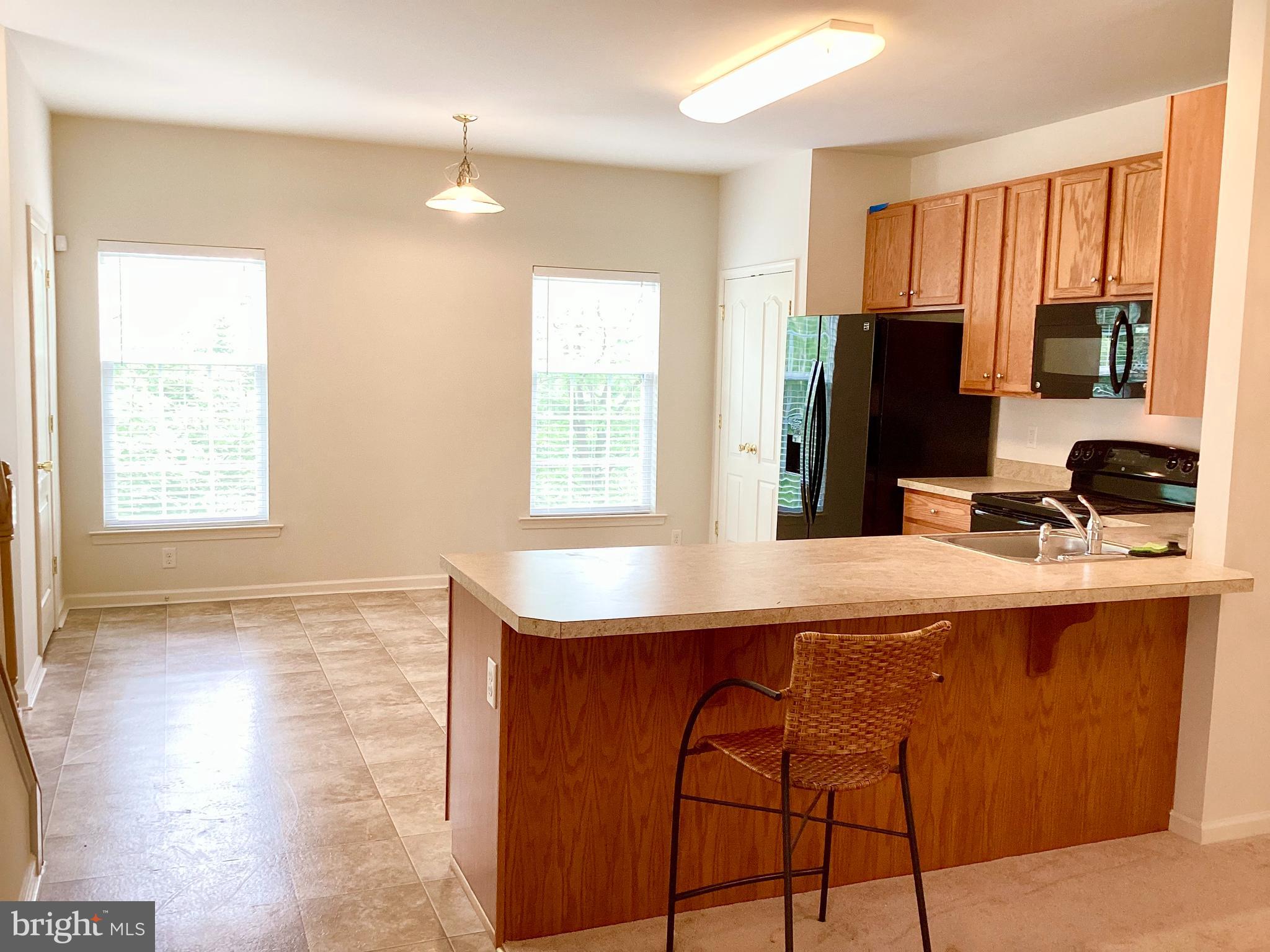 140 Pumpkin Patch Lane Hockessin, DE 19707 - Photo 14 of 25 a kitchen with a sink a window and appliances