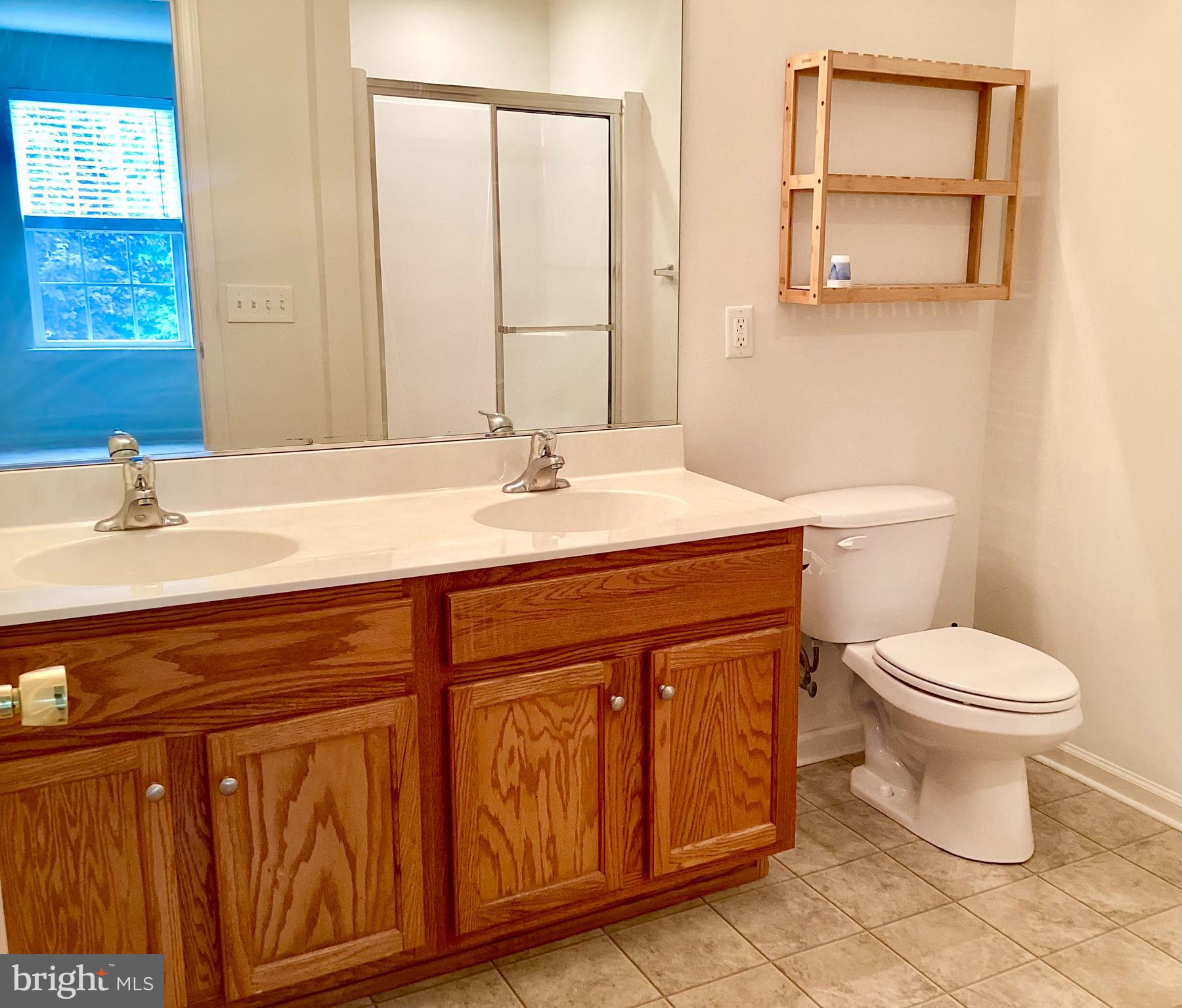 140 Pumpkin Patch Lane Hockessin, DE 19707 - Photo 17 of 25 a bathroom with a sink a toilet and mirror