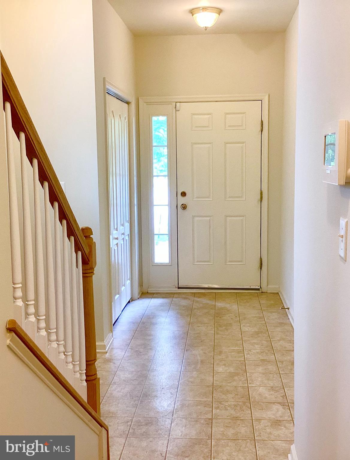 140 Pumpkin Patch Lane Hockessin, DE 19707 - Photo 3 of 25 a view of a hallway with wooden floor and staircase