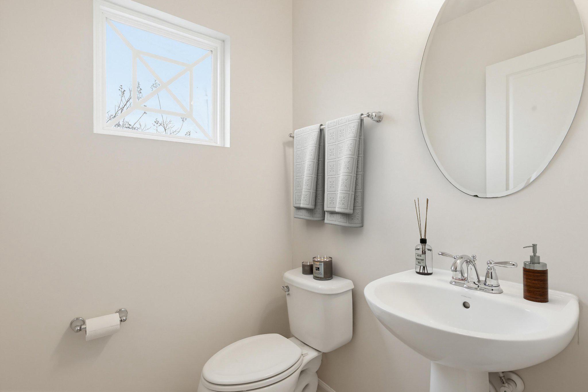 3819 Cullingworth Road Burtonsville, MD 20866 - Photo 18 of 50 a bathroom with a toilet sink and mirror