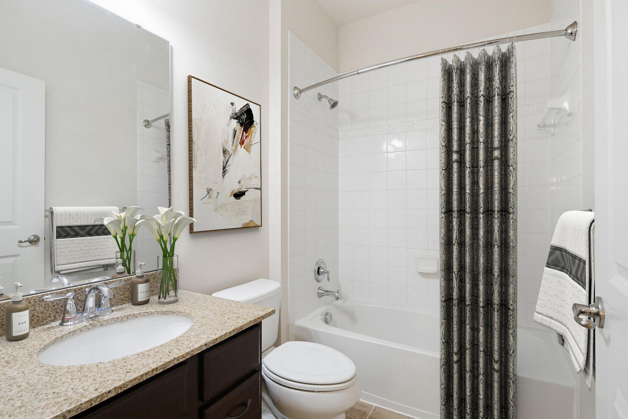 3819 Cullingworth Road Burtonsville, MD 20866 - Photo 34 of 50 a bathroom with a granite countertop sink toilet a shower and a mirror