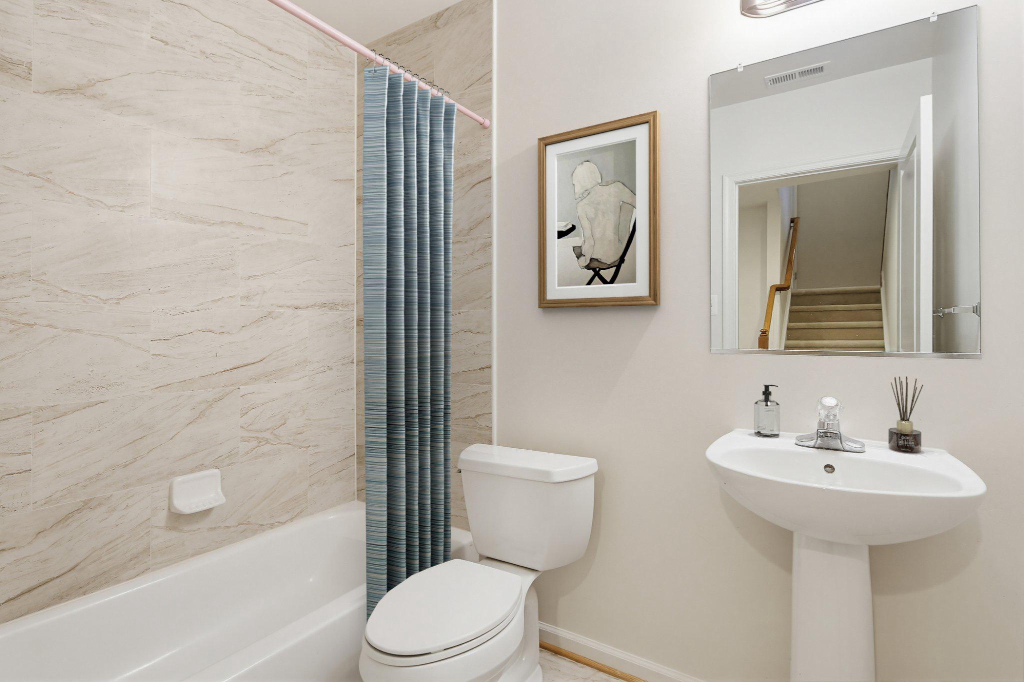 3819 Cullingworth Road Burtonsville, MD 20866 - Photo 40 of 50 a bathroom with a sink toilet and shower