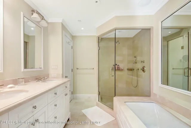 a bathroom with a tub shower and sink