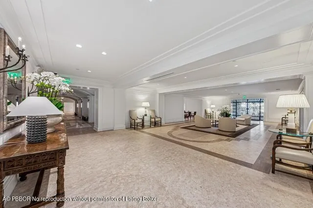 a view of a swimming pool with lawn chairs