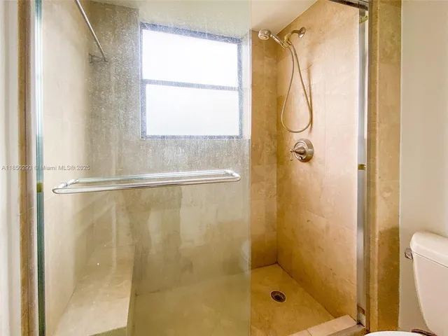 a kitchen with stainless steel appliances granite countertop a stove top oven sink and cabinets