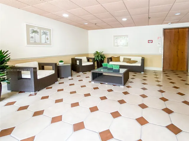 a lobby with a black white checkered floor